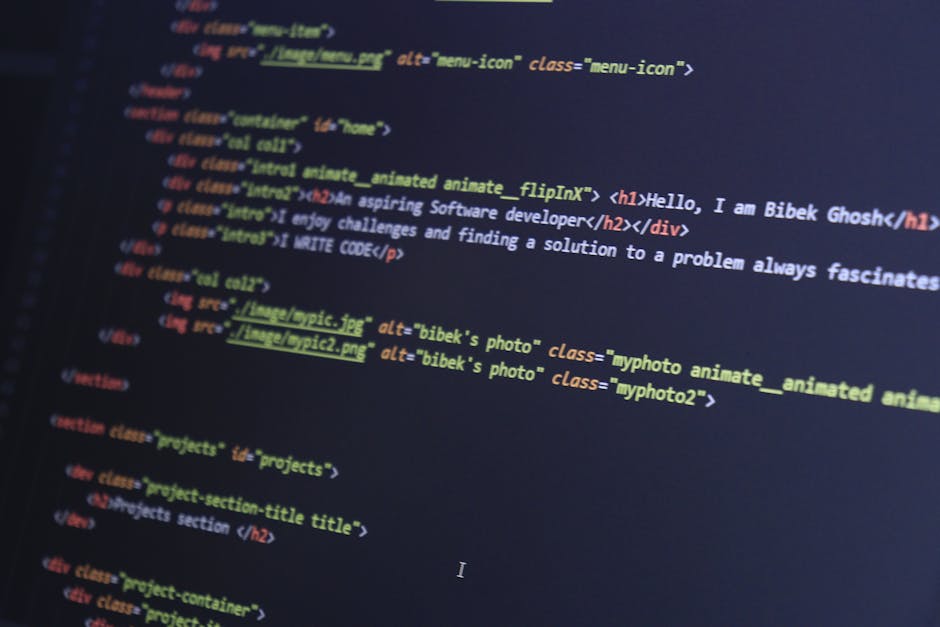 A computer screen displaying a code editor with multiple lines of colourful, blurry programming code in red, green, blue, and purple on a black background. The code includes HTML and CSS elements, wit